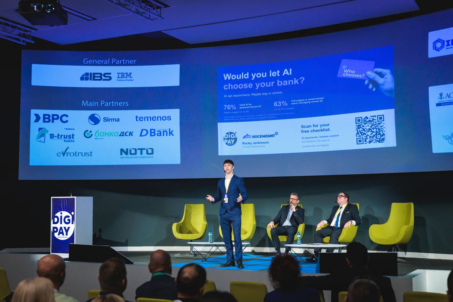 Rocky Jenkinson speaking on stage at DIGI PAY 2026, with his presentation behind him